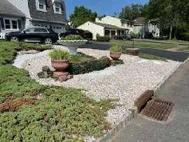 Landscape designer creating a garden plan with plant samples and design tools